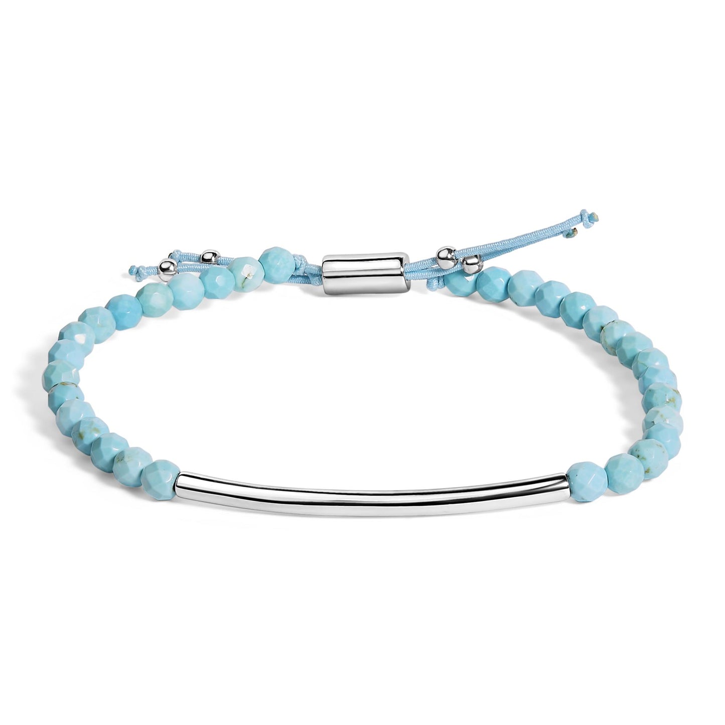 Bracelet with light blue faceted gemstones and a smooth curved white metal bar, shown flat from an overhead angle on a white background.