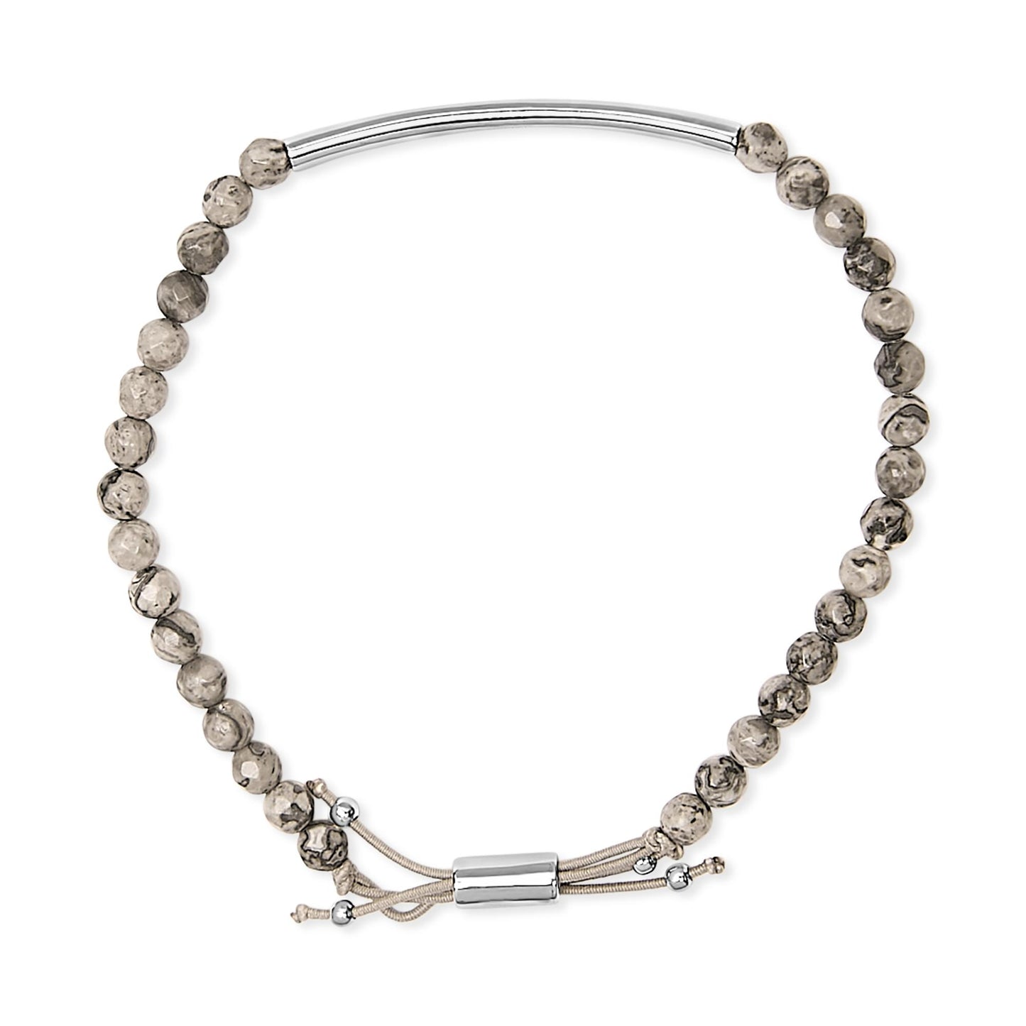 Top-down view of a white metal bracelet featuring patterned round beads and an adjustable cord with metal ends.