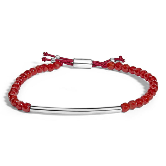 White metal bracelet with a curved rod and red bead accents on a red adjustable cord, shown from a front angle on a white background.