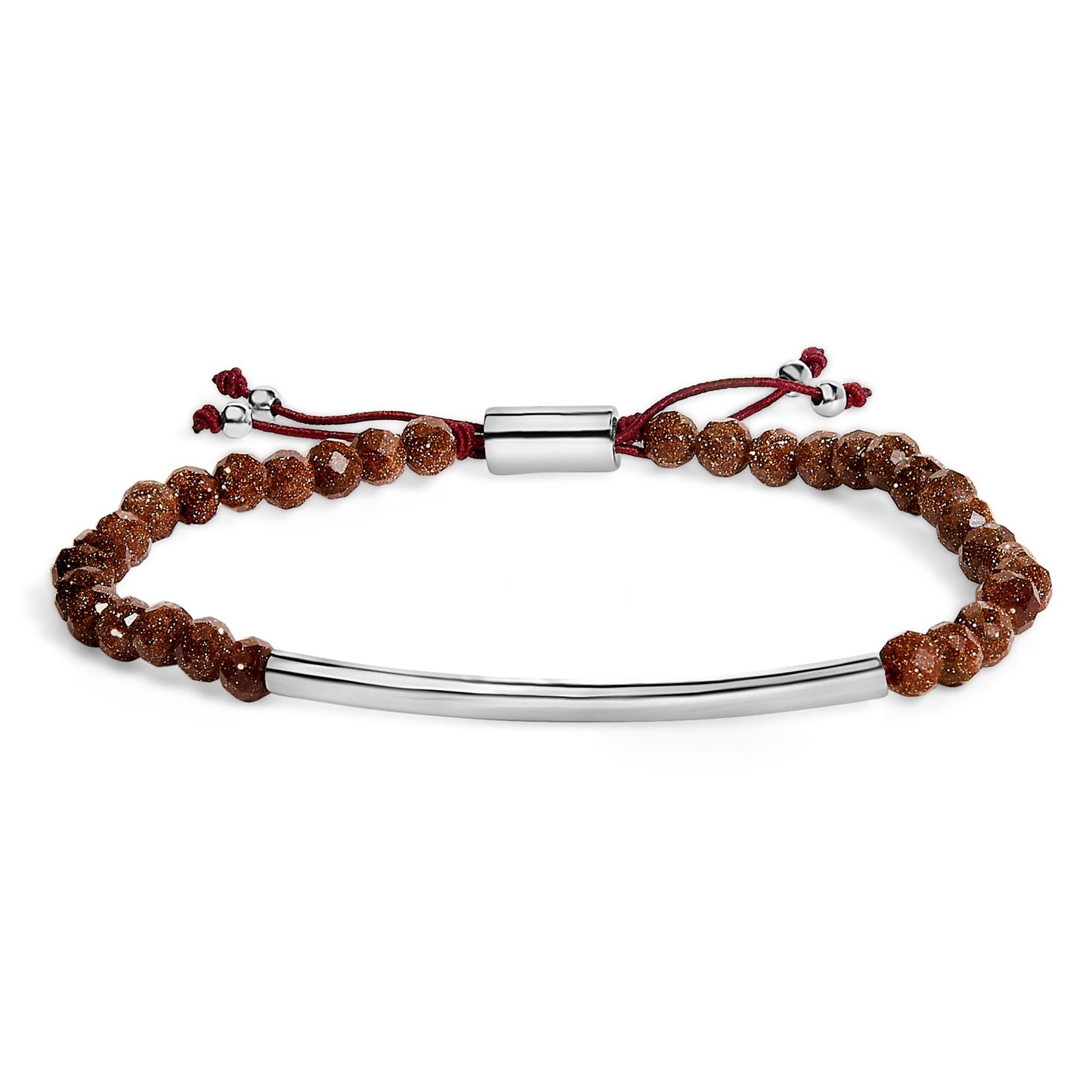White metal bracelet with faceted brown gemstones and a curved metal bar, shown in a front flat lay angle.