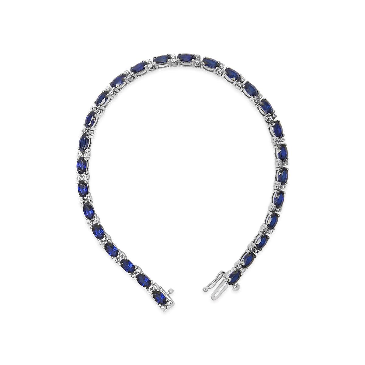 White metal bracelet shown on a white background, composed of alternating oval blue gemstones and small round white gemstones in prong settings, displayed from an overhead angle.