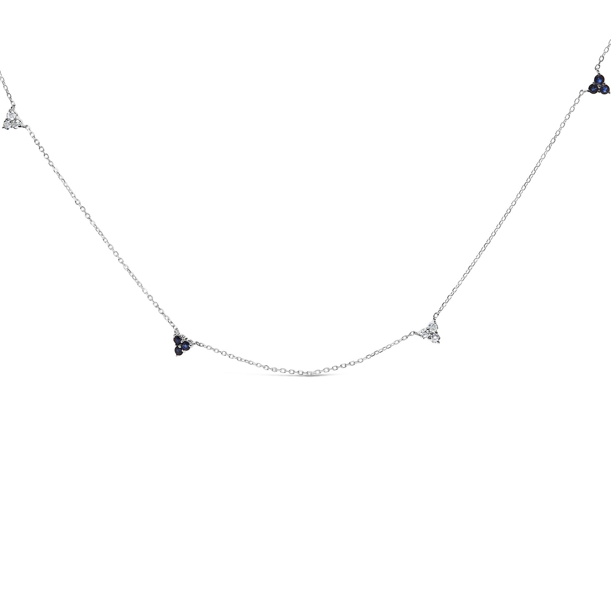 White metal necklace shown against a white background with round blue and white gemstones set in small clusters along the delicate chain, photographed from a front angle.