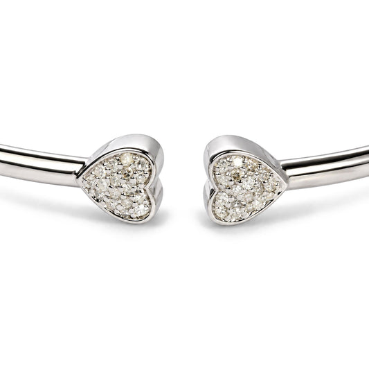 Close-up of 925 sterling silver 1/6 Cttw diamond twin heart open flexy bangle bracelet showing two heart-shaped diamond ends