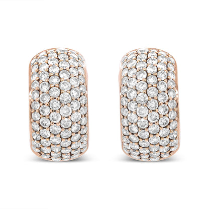 Pair of rose metal earrings with round white gemstones set in prong settings, shown from a front-facing angle.