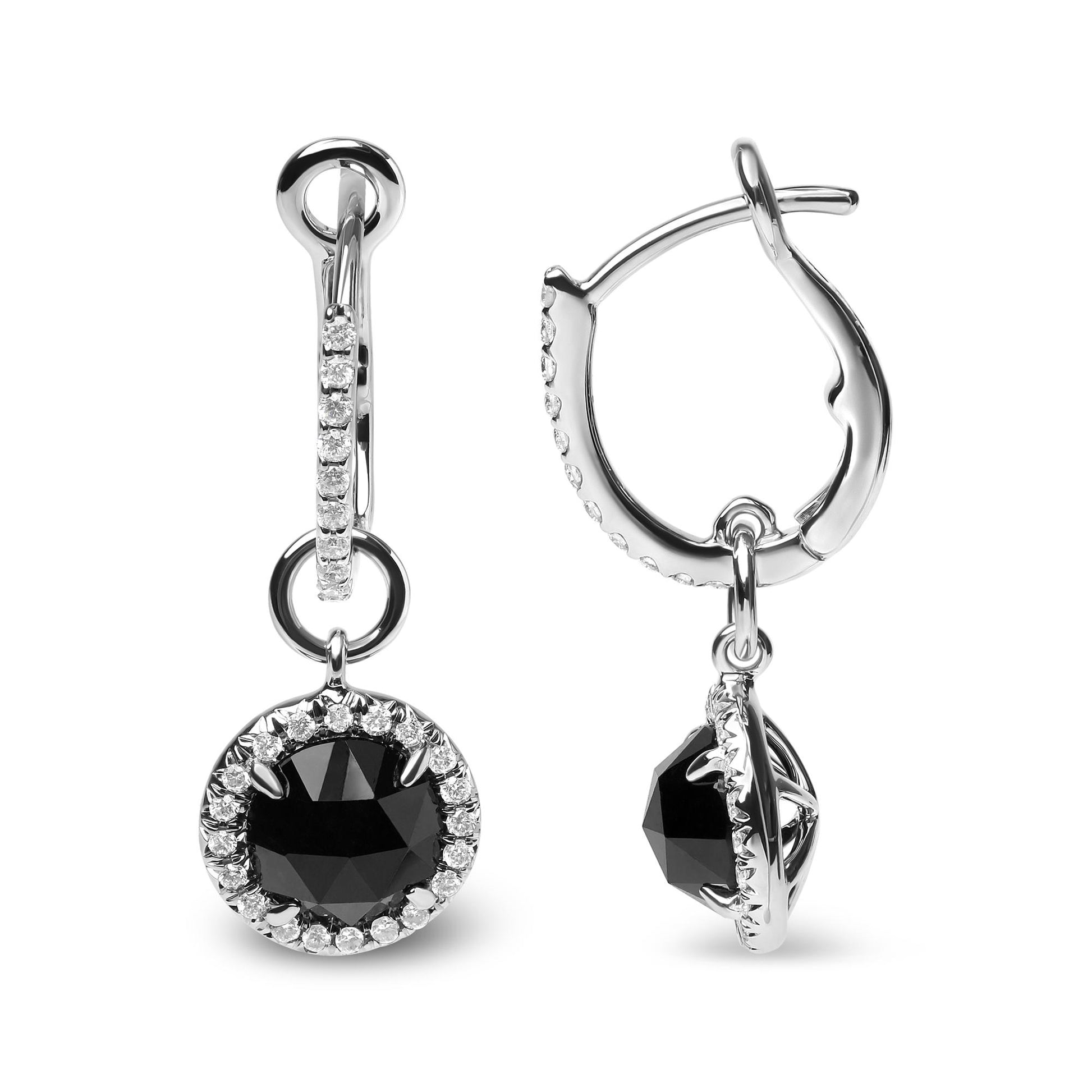 Pair of white metal hoop earrings with round black gemstones surrounded by white gemstones, front and side views, isolated on white background.