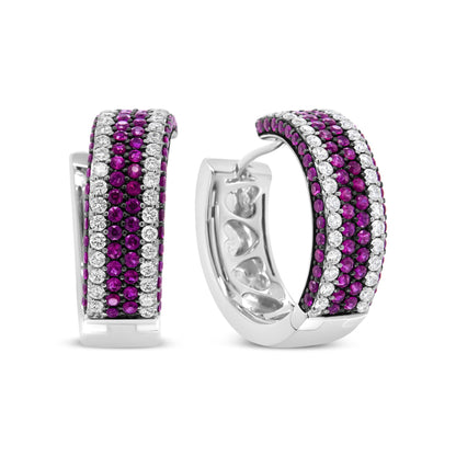 Pair of white metal hoop earrings set with alternating rows of round red and white gemstones, shown in a front and angled view on a white background.
