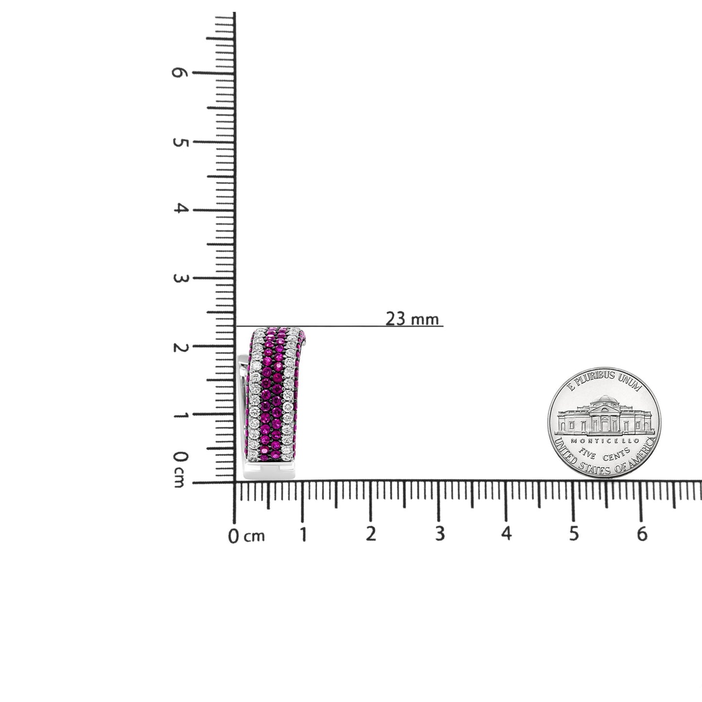 Close-up side view of a white metal earring with alternating rows of round red and white gemstones in prong settings, placed on a ruler and scale for size reference.