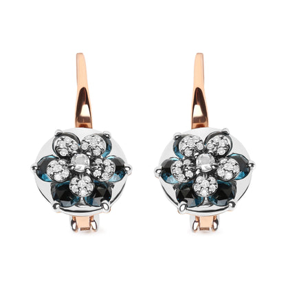 Front view of white and rose metal earrings with floral design featuring round blue gemstones and multiple small white gemstones in prong settings.