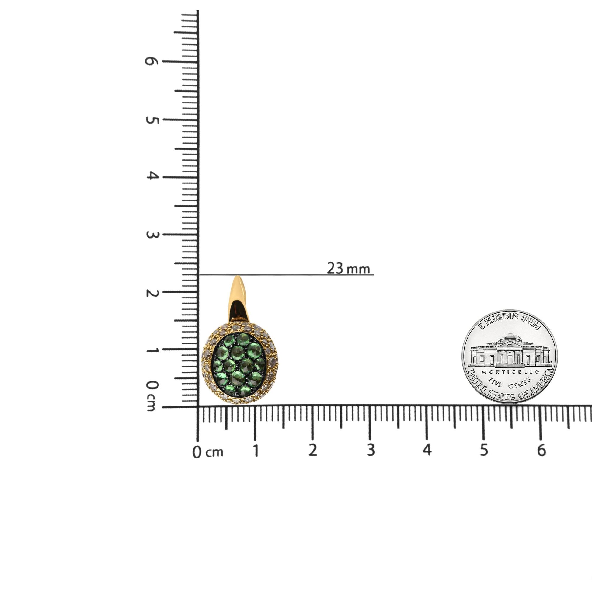 Single yellow and black earring with round green and brown gemstones, shown front-facing on a ruler for size reference.