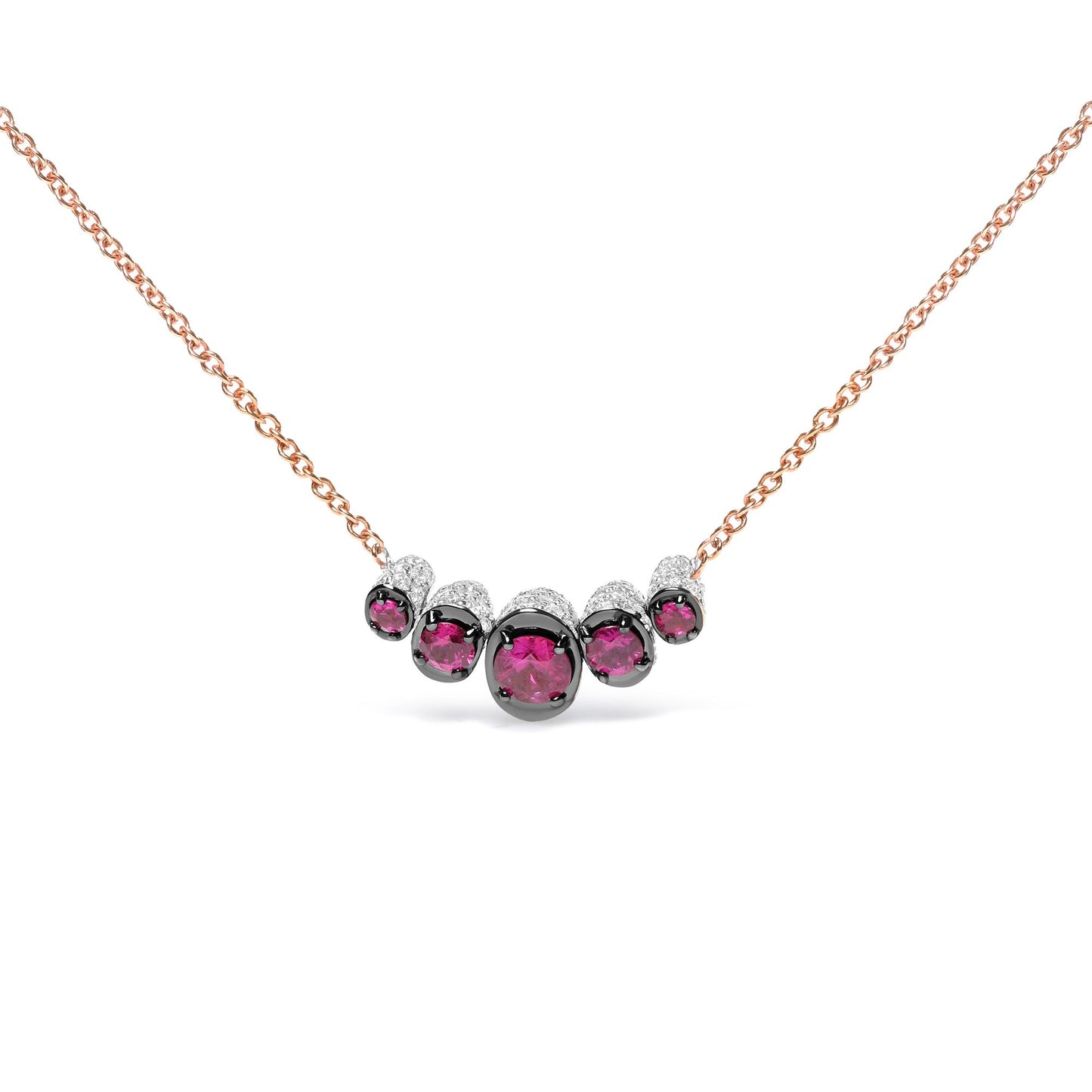 Front view of a rose metal necklace featuring a curved row of round red gemstones in prong settings, accented with small round white gemstones in pave settings.