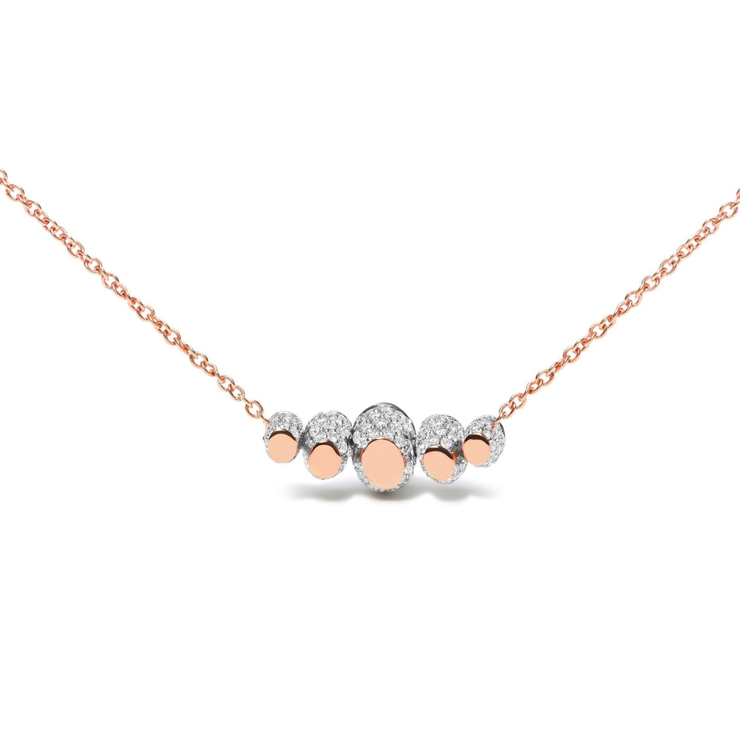 Front-facing close-up of a rose-colored necklace with a central cluster of oval shapes surrounded by white gemstones in pave settings.