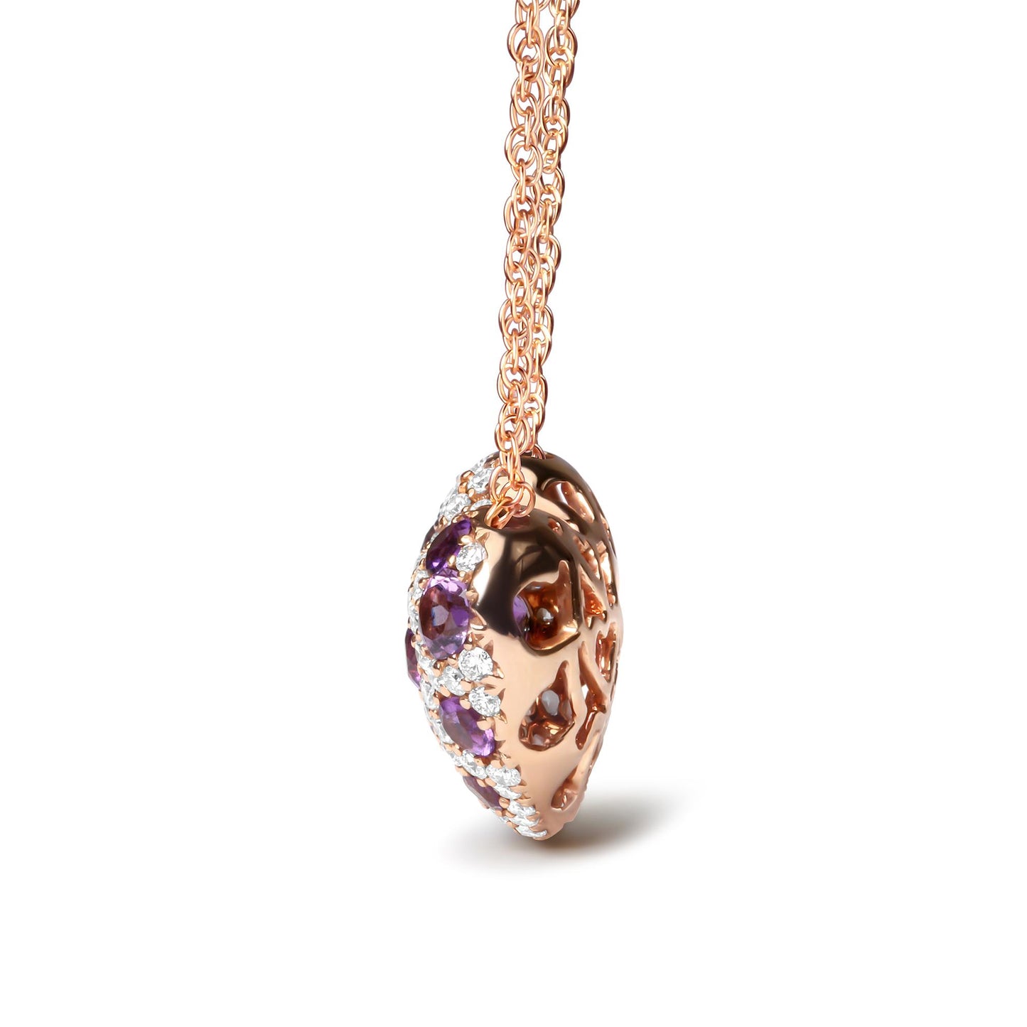 Close-up side angle of a rose metal necklace pendant adorned with round purple and white gemstones in prong settings, shown hanging against a white background.