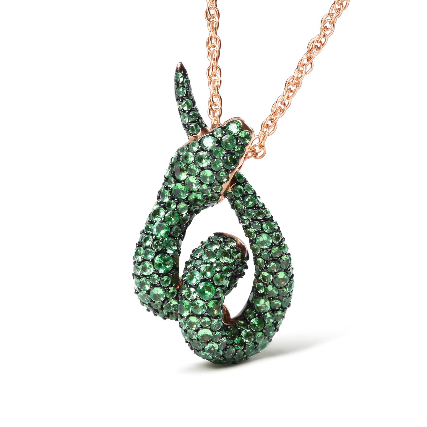 Rose metal necklace with a snake-shaped pendant covered in green round pave-set gemstones, photographed at a slight angle against a white background.