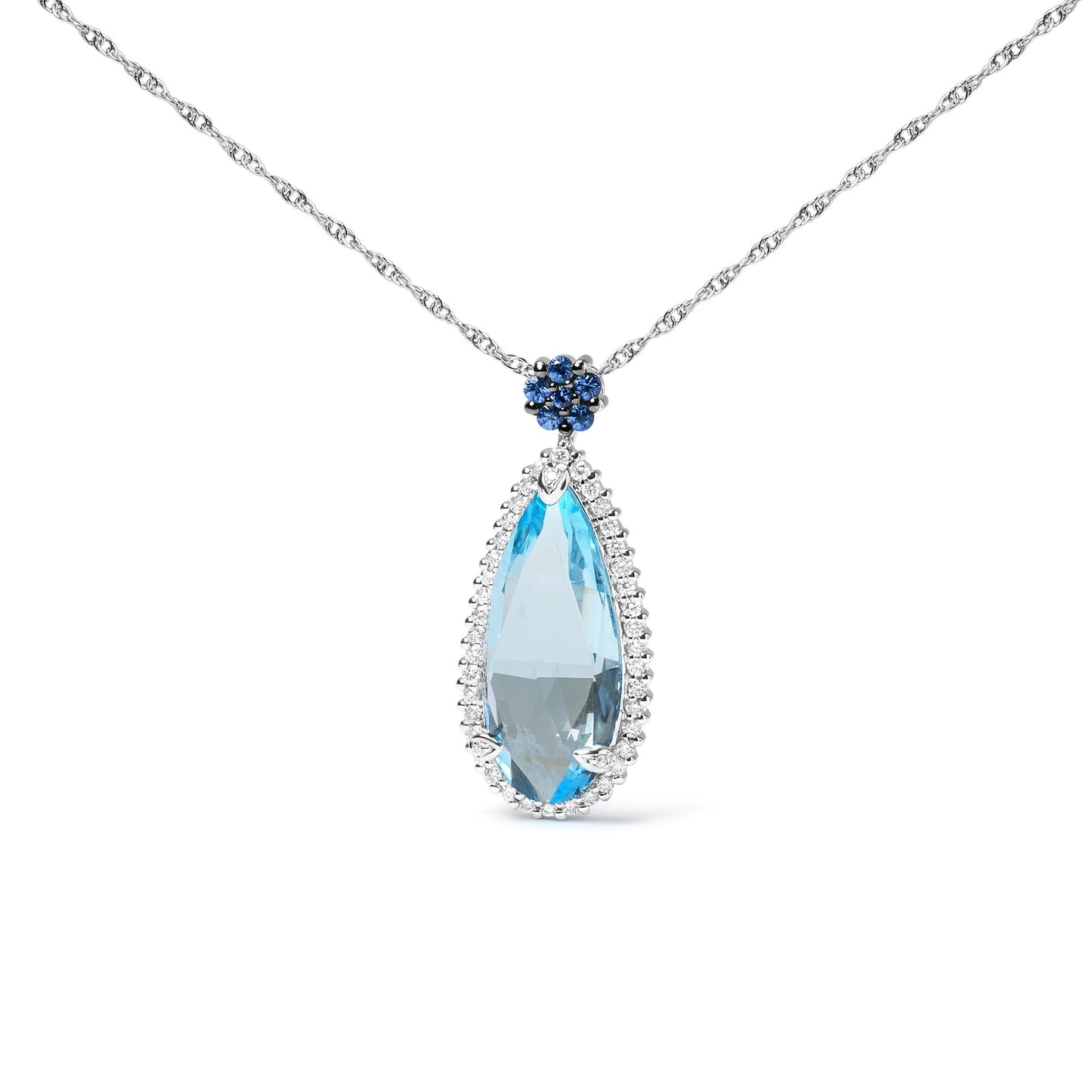 Front angle view of a white metal necklace with a large pear-shaped blue gemstone pendant surrounded by small white gemstones, topped by a cluster of round blue gemstones on a white metal chain.