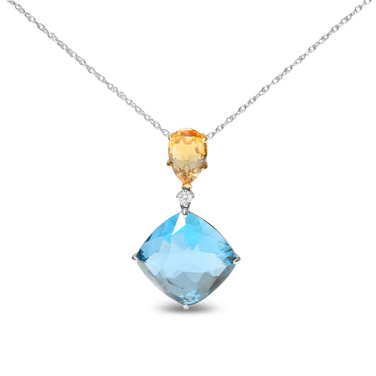 Front view of a necklace with a yellow pear-shaped gemstone pendant above a larger blue cushion-shaped gemstone, separated by a small round white gemstone, with a two-tone chain.