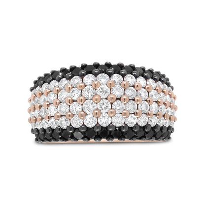 Close-up front view of a rose-colored ring featuring alternating rows of round white and black gemstones in prong settings.