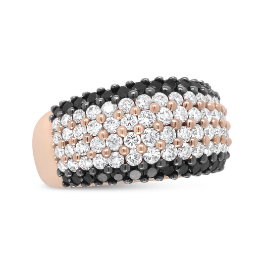 Close-up of a rose metal ring with multiple rows of round white and black gemstones set in prongs, shown at a slight angle.