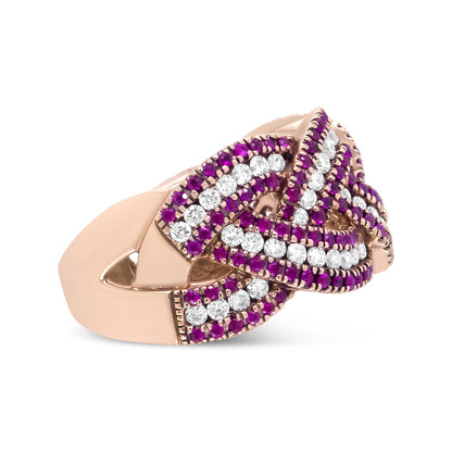 Close-up side angle of a rose-colored ring featuring an intertwined design with rows of round white gemstones and red gemstones in prong settings.