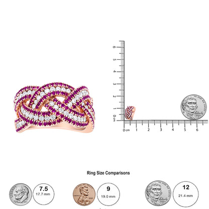 Rose metal ring with intertwined rows of red and white round gemstones in prong settings, shown from a front angle and placed on a ruler for size reference alongside coins.