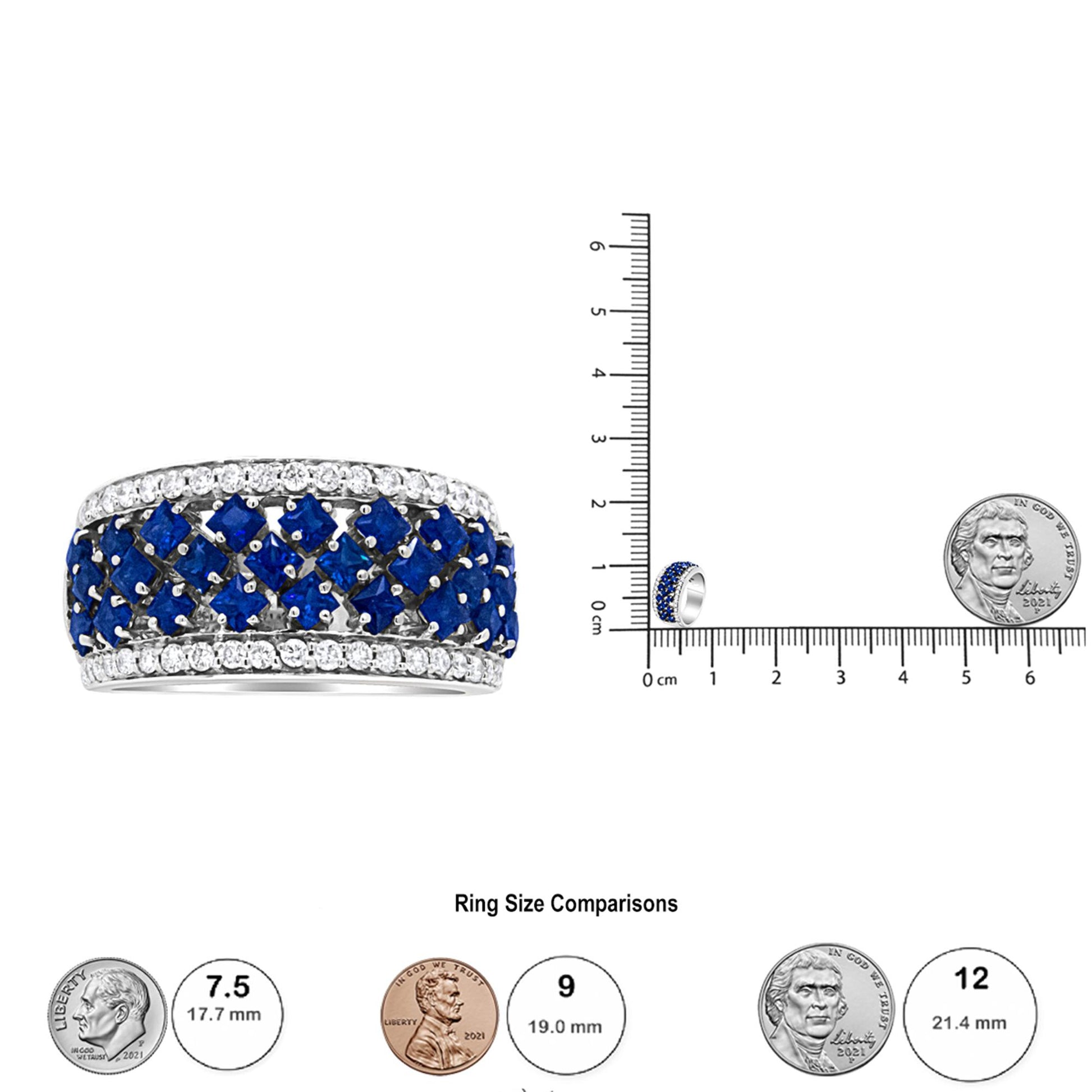 White ring with blue square and white round gemstones in prong settings, shown at an angle on a ruler for size reference.