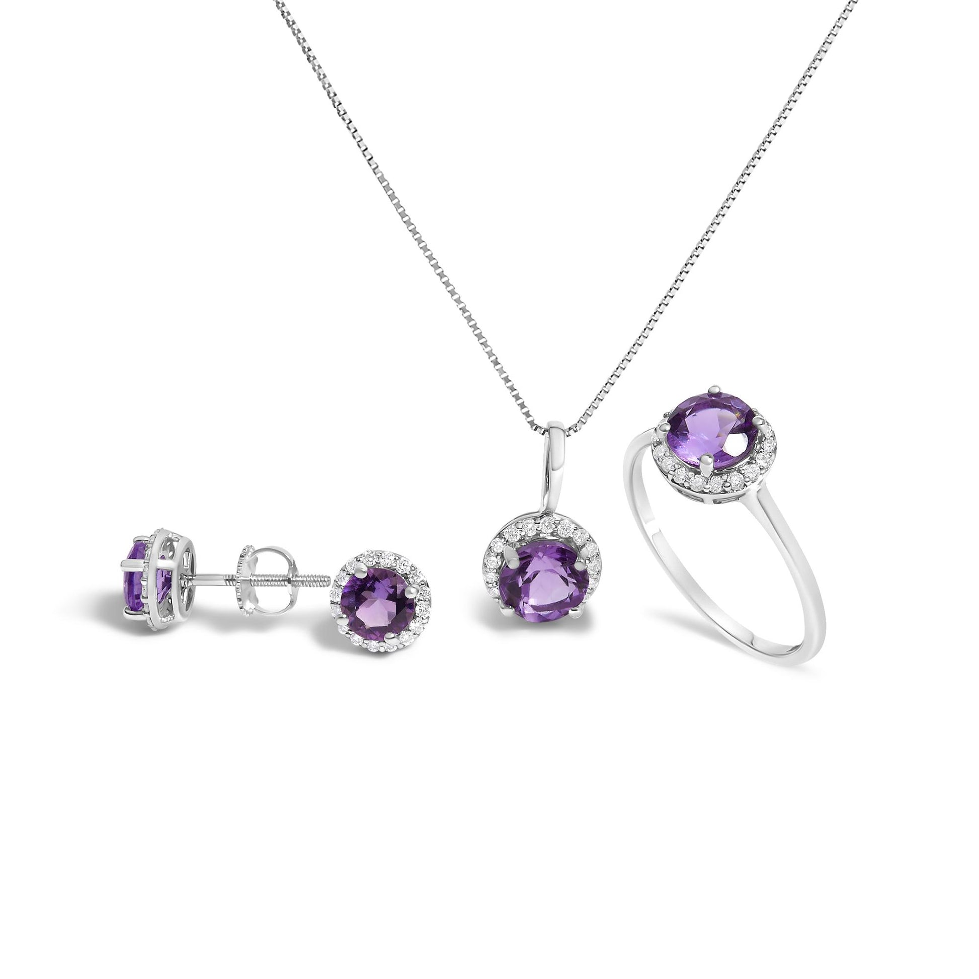 White metal jewelry set shown from the front on a white background, featuring a necklace with a pendant, a pair of stud earrings, and a ring, each with a round purple gemstone surrounded by small white gemstones.