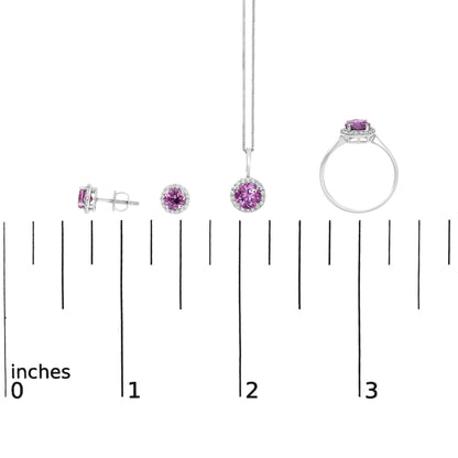 Set of white metal jewelry shown on a scale, including a pair of stud earrings, a pendant necklace, and a ring, each featuring round purple gemstones surrounded by small round white gemstones, displayed from side and front angles.