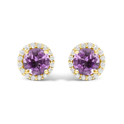 Pair of round purple gemstone stud earrings surrounded by a halo of white round gemstones in shared prong settings, shown in a front-facing view on a white background.