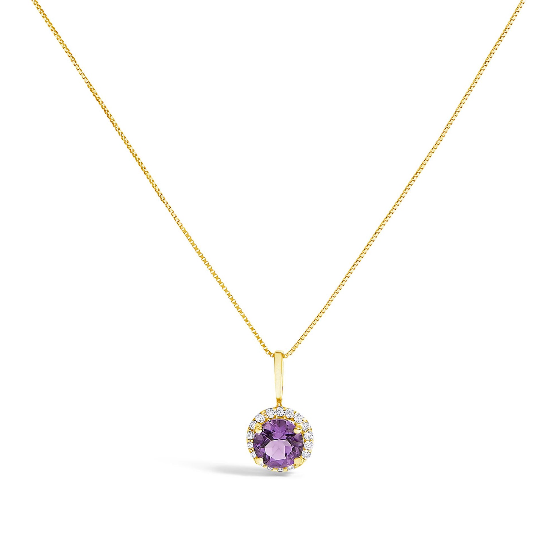 Close-up front view of a yellow metal necklace set featuring a round purple gemstone pendant surrounded by multiple small white gemstones in a shared prong setting.