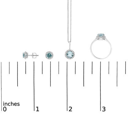 Set of earrings, pendant, and ring with round blue gemstones surrounded by white gemstones, shown on a scale, front and side angles.