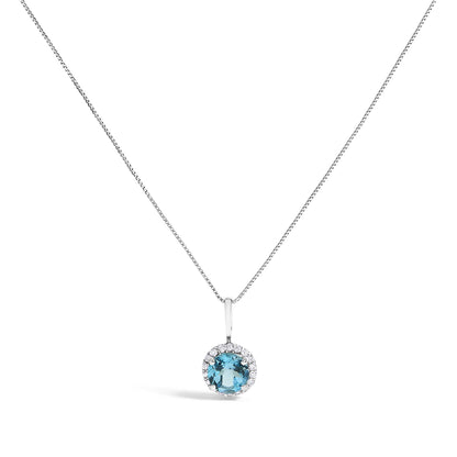 Close-up front view of a white metal necklace with a round blue gemstone pendant surrounded by small white gemstones, shown on a white background.