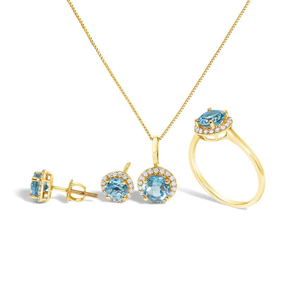 Set of yellow jewelry including a necklace with a pendant, a pair of stud earrings, and a ring, all featuring round blue gemstones surrounded by a circle of small white gemstones, shown from a front angle on a white background.