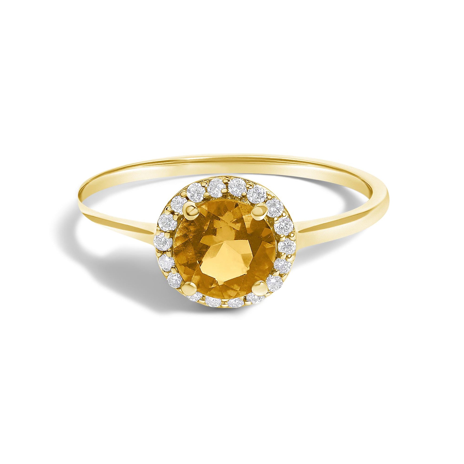 Yellow metal ring with a round orange gemstone center surrounded by small round white gemstones in a shared prong setting, shown in a close-up front angle.