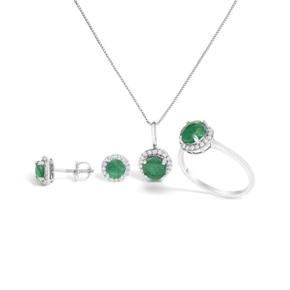 Set of white metal jewelry shown from front and side angles on a white background, featuring round green gemstones surrounded by small round white gemstones, including a pair of stud earrings, a pendant necklace, and a ring.