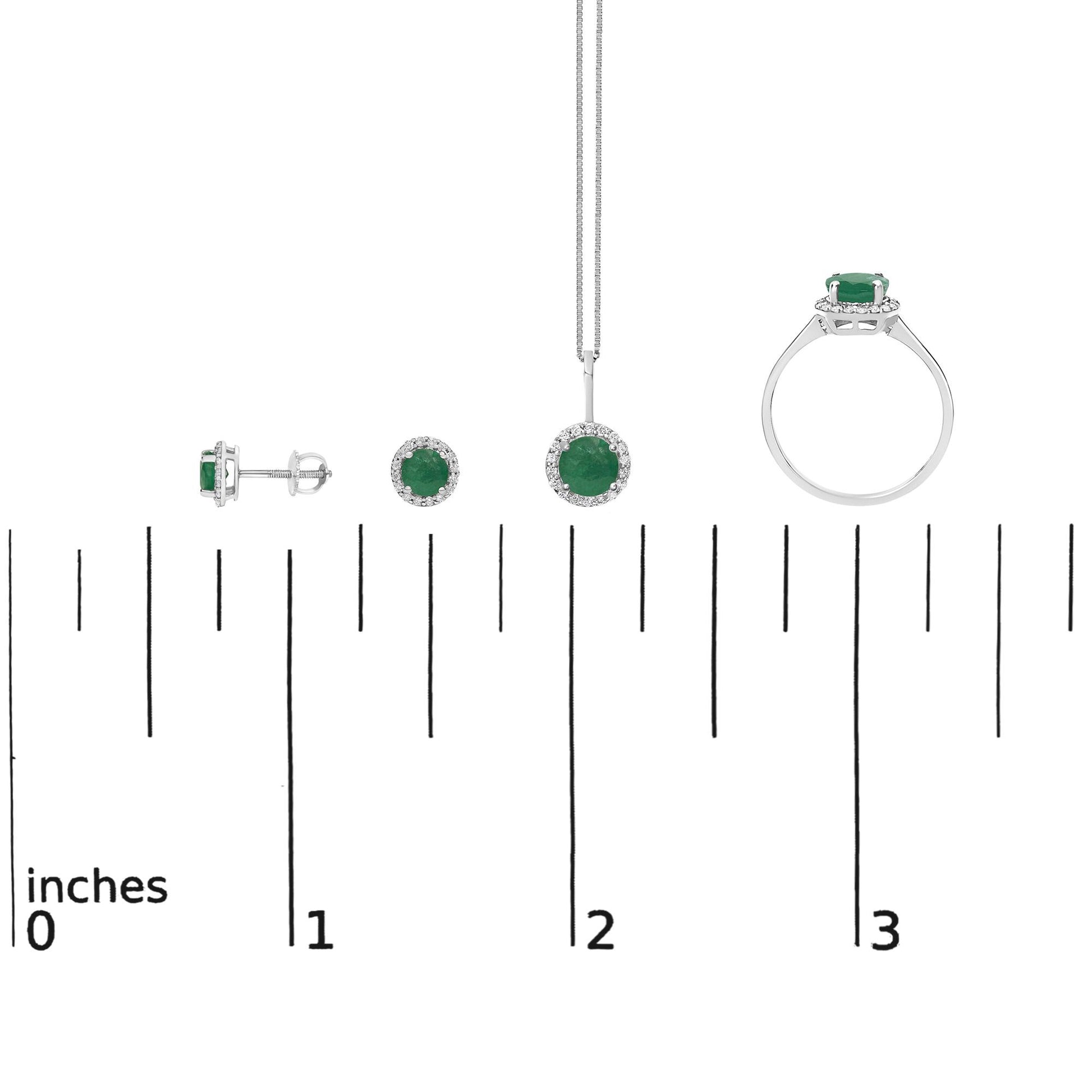 Set of white metal jewelry shown on a scale, including a pair of stud earrings, a pendant necklace, and a ring, each featuring a round green gemstone surrounded by small white gemstones, displayed in a front and side view with a white background.