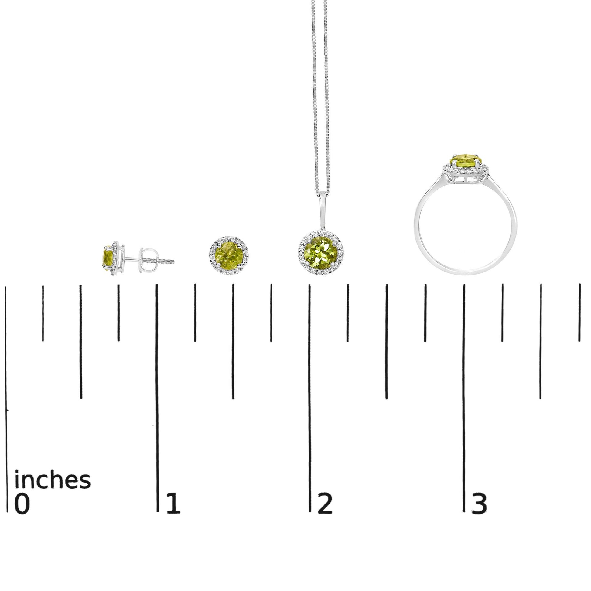 Jewelry set with earrings, pendant, and ring featuring round green gemstones surrounded by round white gemstones, shown on a scale from side and front angles.