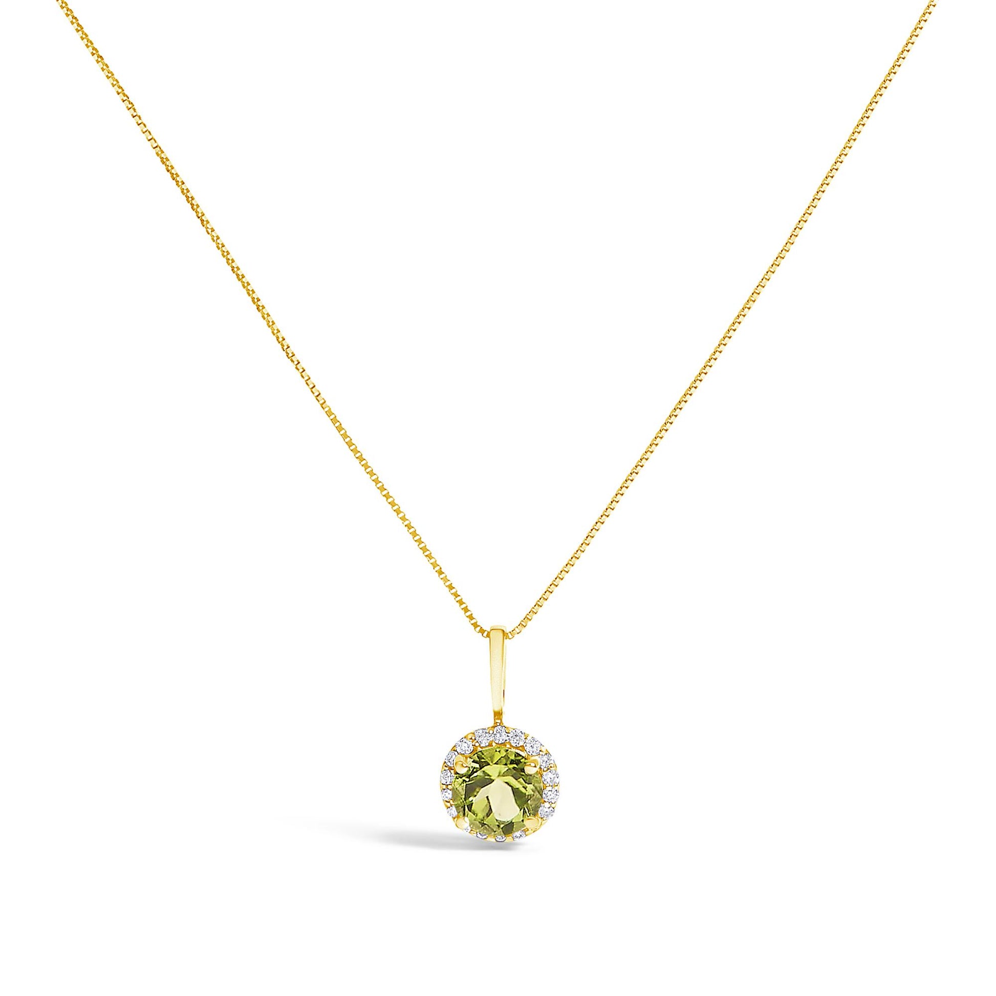 Front view of a yellow metal necklace set featuring a round green gemstone pendant surrounded by small white gemstones in shared prong settings.