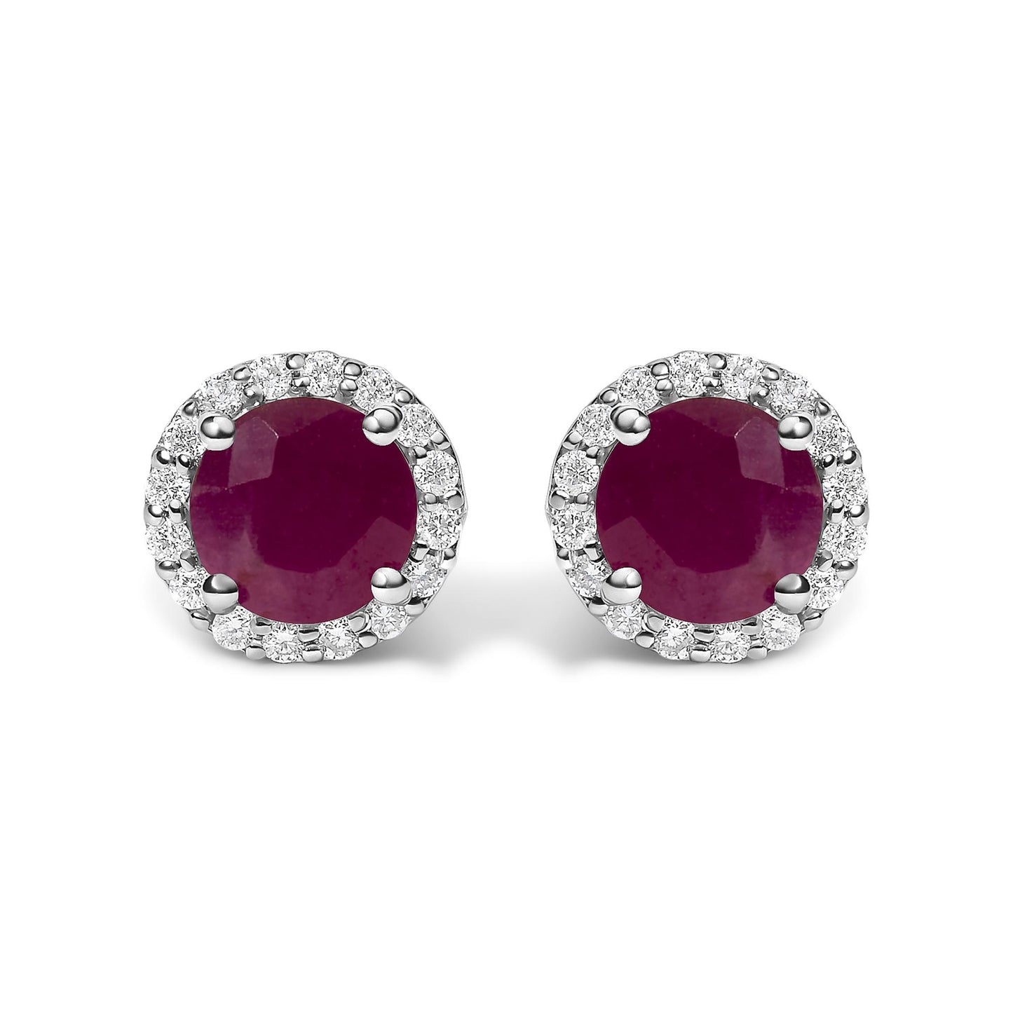 Close-up front view of a pair of round stud earrings featuring a central red gemstone surrounded by a halo of small white gemstones in shared prong settings.