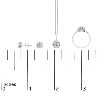 White metal jewelry set shown on a scale, including round white gemstones in shared prong settings: one pair of stud earrings viewed from the front and side, one round pendant necklace hanging vertically, and one ring viewed from the side, all featuring halo-style settings around central round white gemstones.
