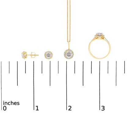 Yellow metal jewelry set shown on a scale, includes round stud earrings, a pendant necklace, and a ring, each featuring a central round white gemstone surrounded by smaller round white gemstones. The shot is from the front and side angles.